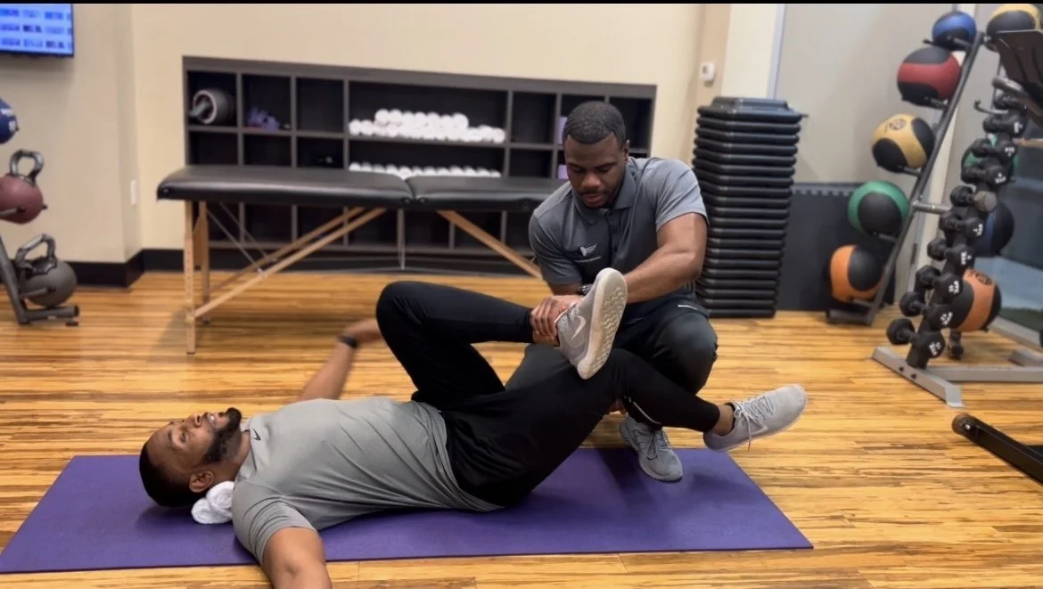Dr. Miller Active Stretching with client at Feel Free Physical Therapy