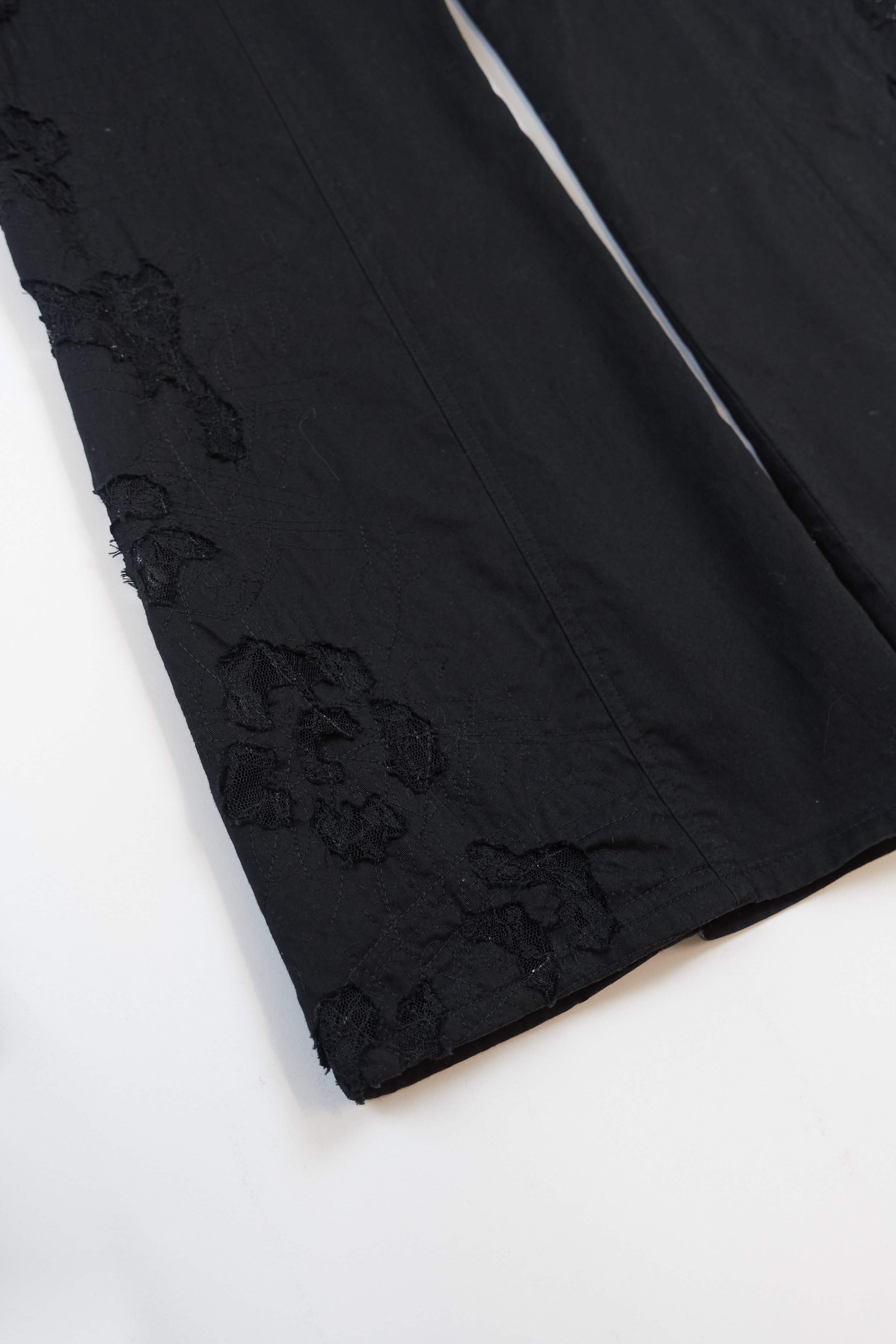 ISSEY MIYAKE black lace cutout trousers 887 220512.jpg