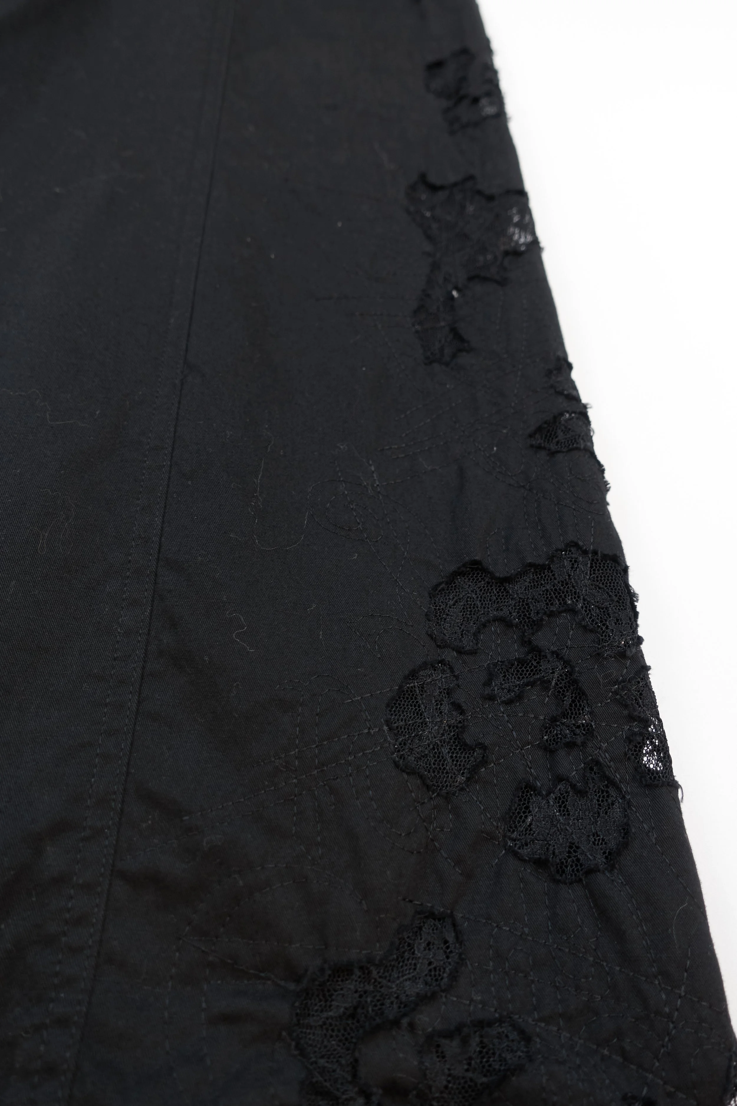 ISSEY MIYAKE black lace cutout trousers 888 220512.jpg