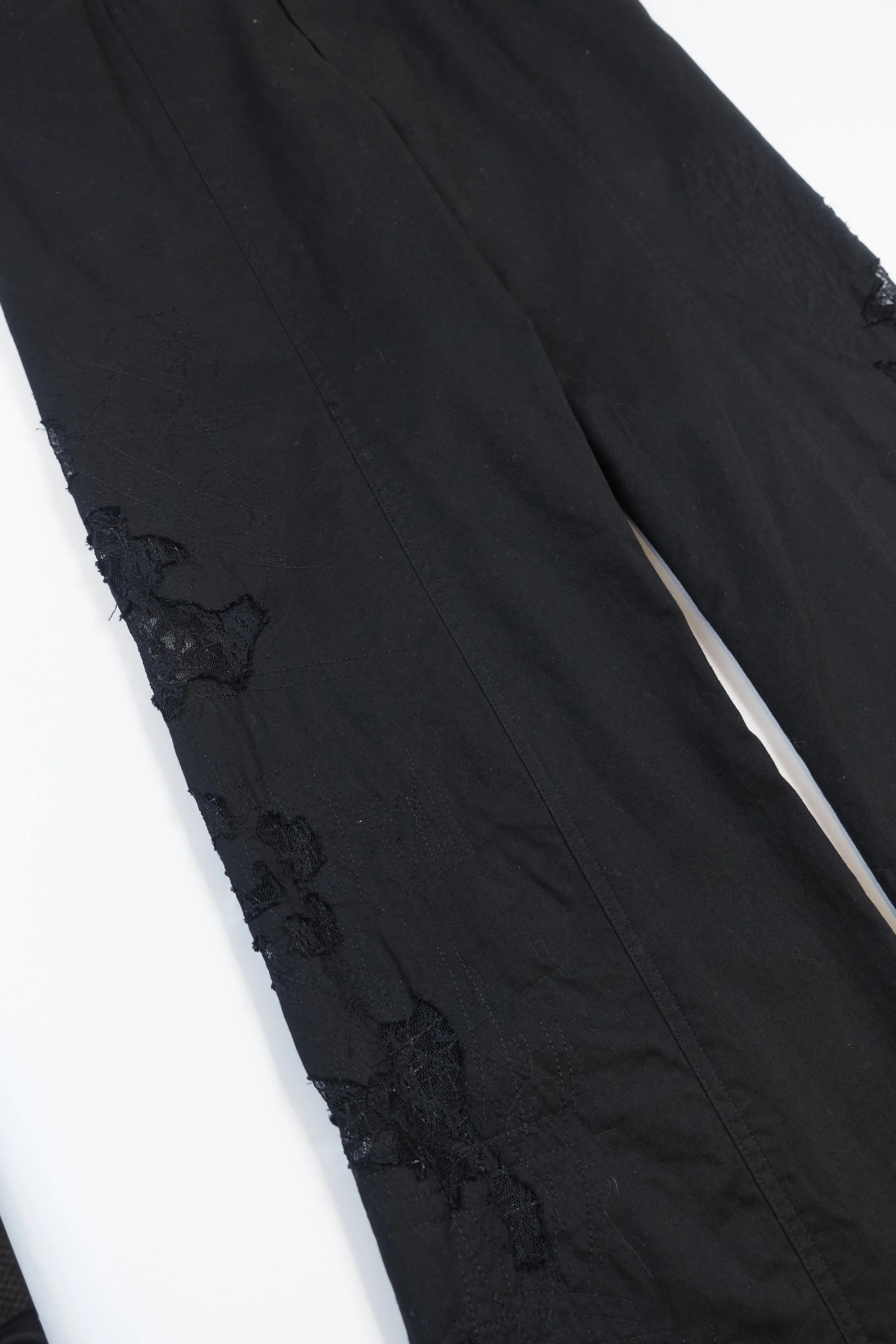 ISSEY MIYAKE black lace cutout trousers 885 220512.jpg