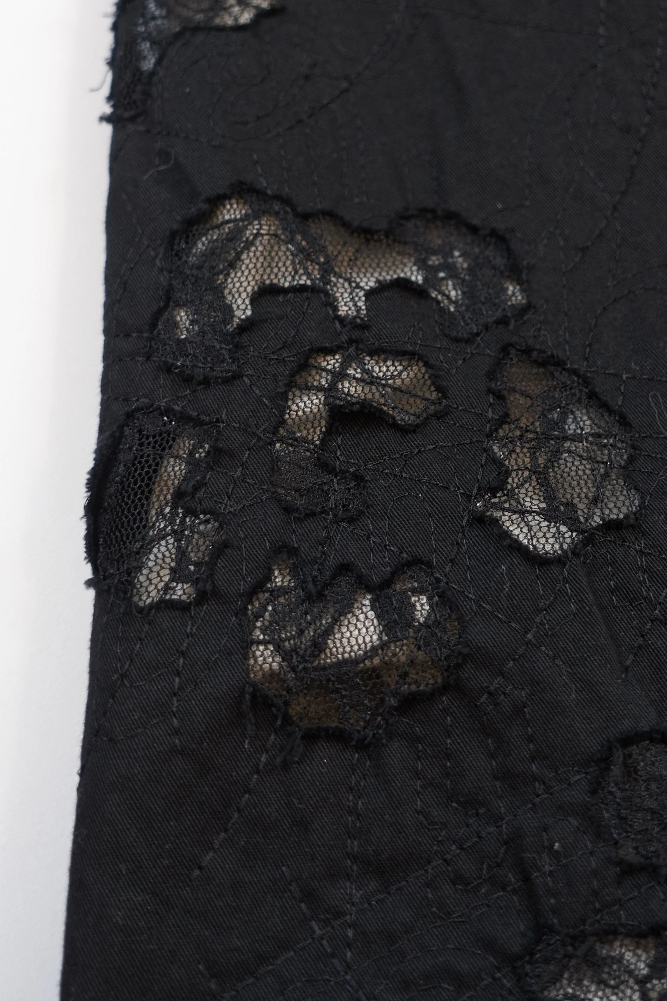 ISSEY MIYAKE black lace cutout trousers 891 220512.jpg
