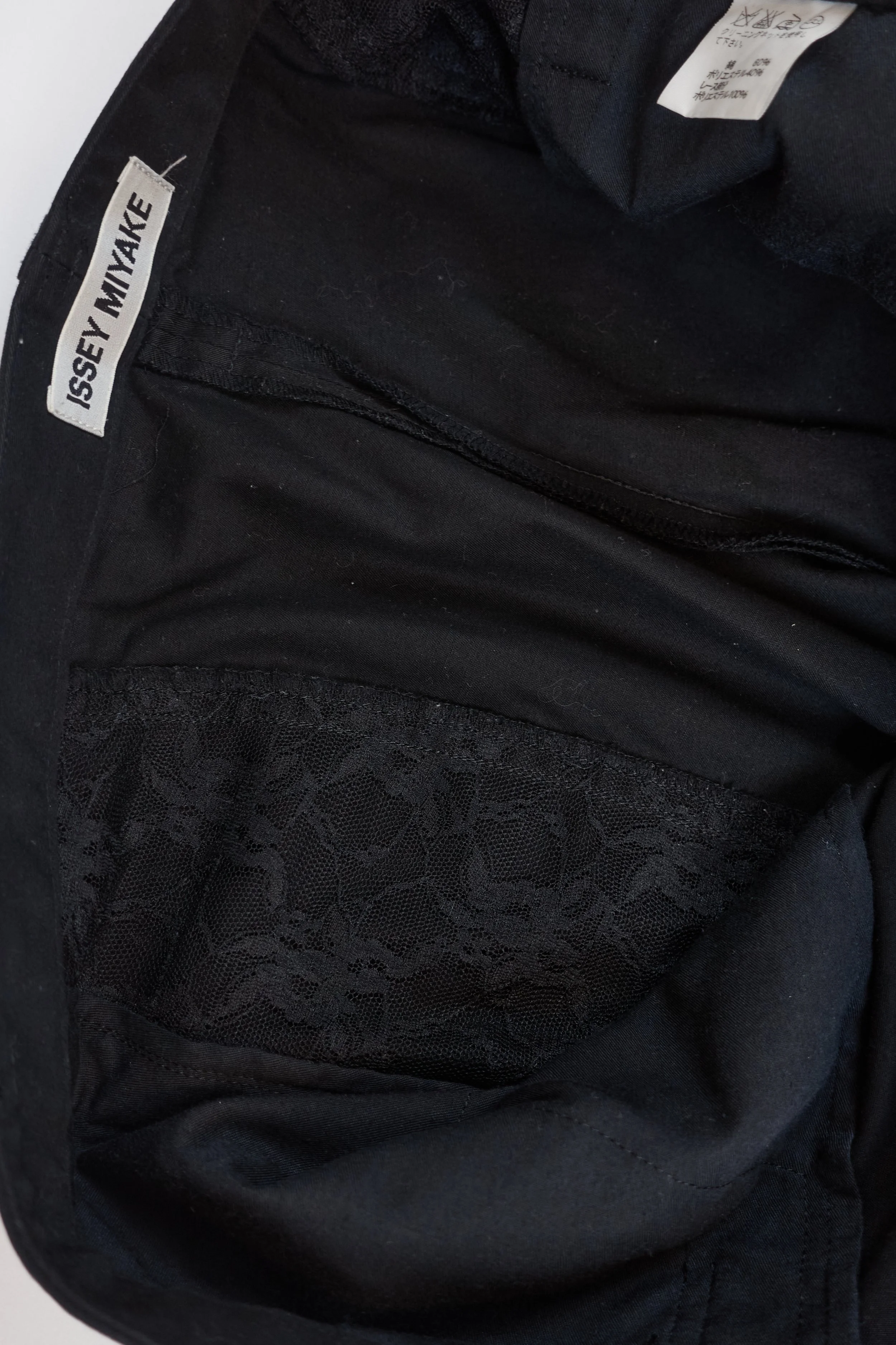 ISSEY MIYAKE black lace cutout trousers 890 220512.jpg