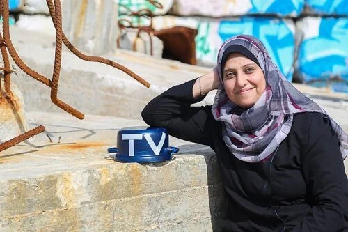 Palestine: CFWIJ Stands In Solidarity With Photojournalist Samar Abu Elouf Amidst Israeli Airstrikes.