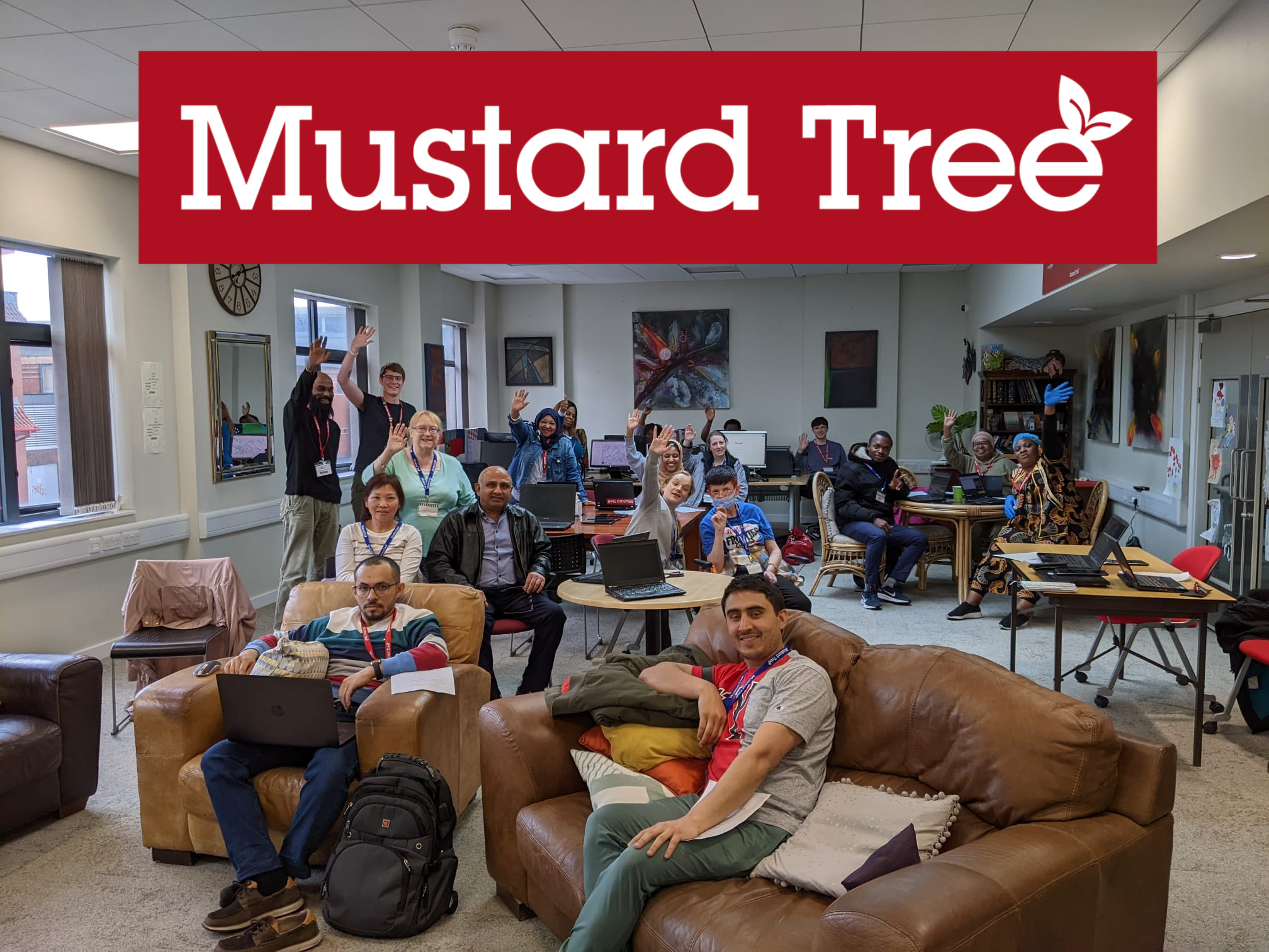 group of people with mustard tree logo above