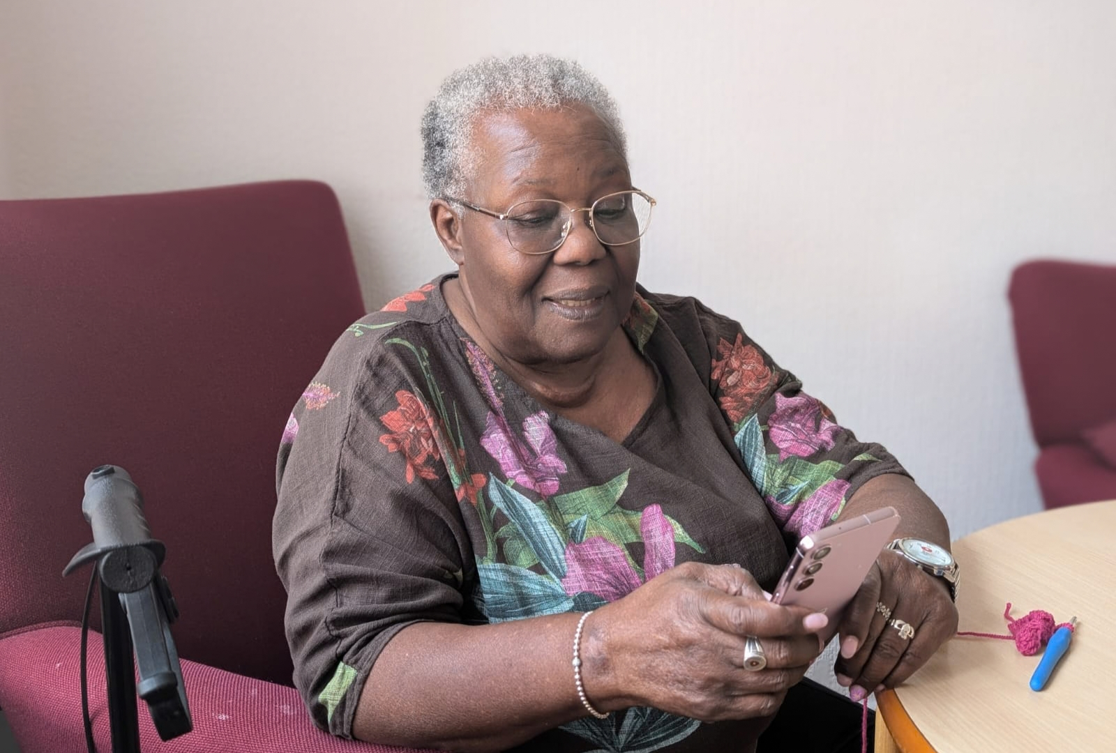 Woman from Many Hands using her new smartphone