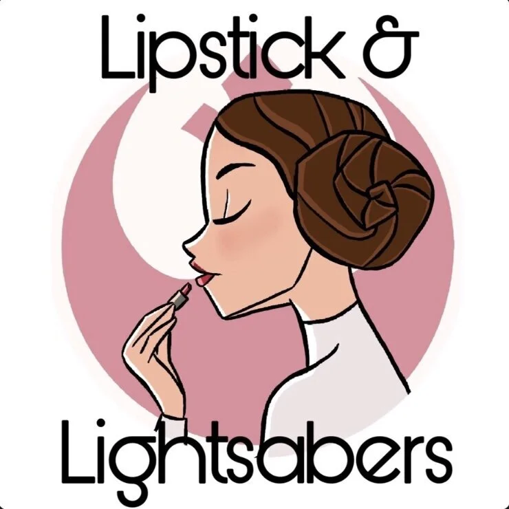 Cartoon of a woman with brown hair in buns applying lipstick, with the text 'Lipstick & Lightsabers' and a circular pink and white background.