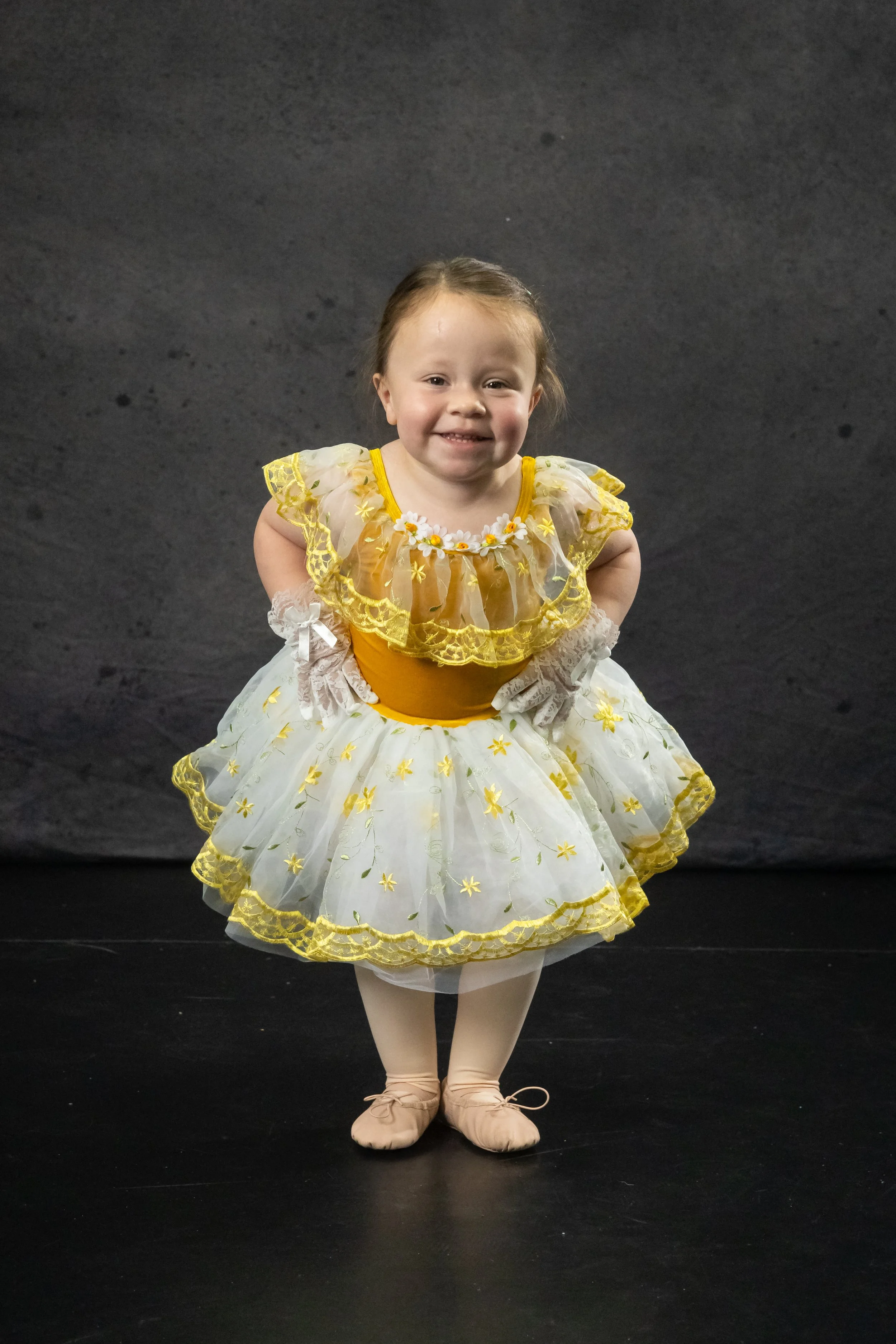 Cute dancer in a blue long tutu