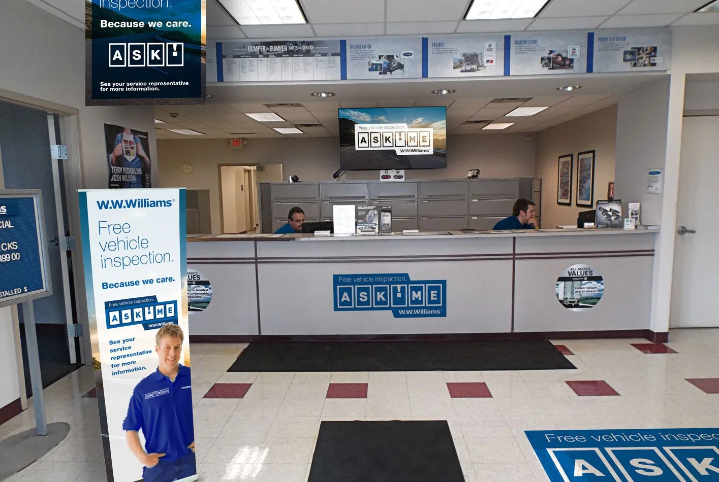 a W.W. Williams reception area with a sign and a person in the background