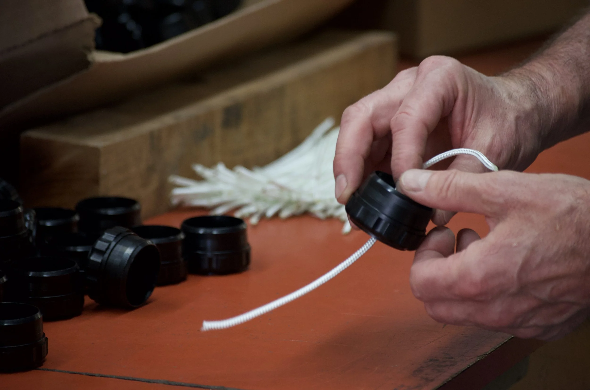 John putting rope through on the TBC Divot Bottle.jpeg