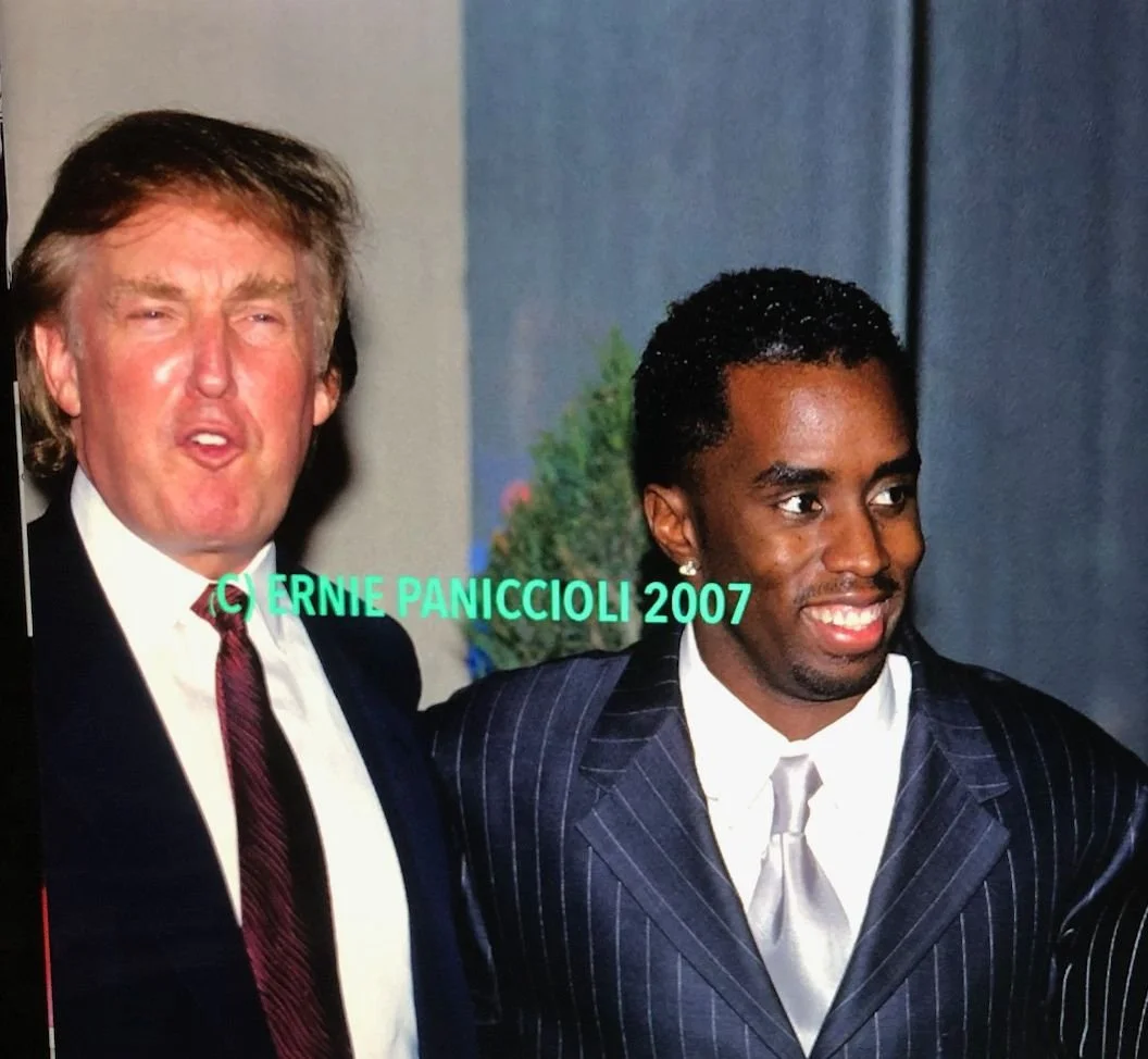 A photograph of the 2 NYC bad boy billionaires Donald and Diddy, who tried to disrupt the 'SLAM' wrap party until the poets stood strong and demanded "Get Back, Get Out."  Can America do the same now?