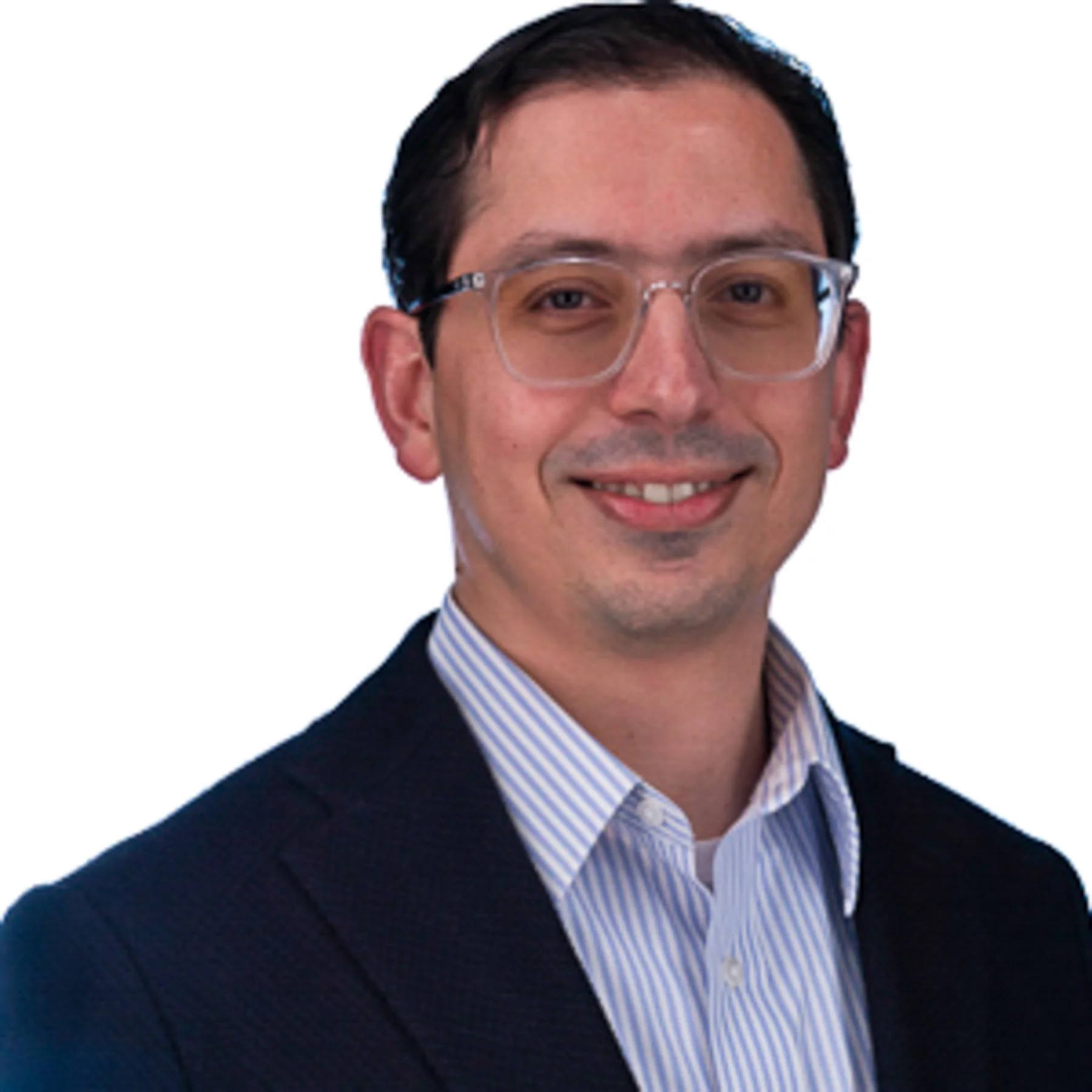 A man wearing glasses and a dark blazer, smiling, with a white background.