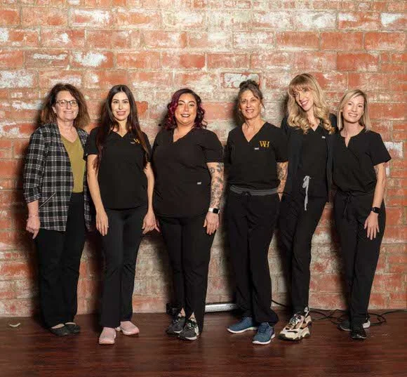 Group headshot of women working at a Medical Spa
