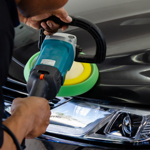 “Machine polishing car paint to remove swirl marks and restore gloss”