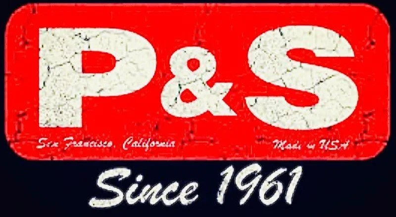 A red and black sign with white text that reads "P & S" and "Since 1961". Small cursive text underneath says "San Francisco California" and "Made in Italy".