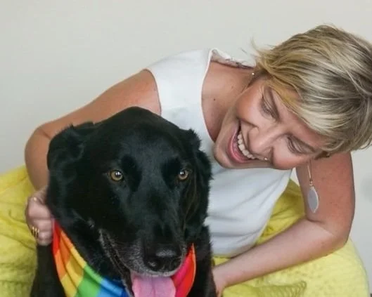 Boy hugging therapy dog