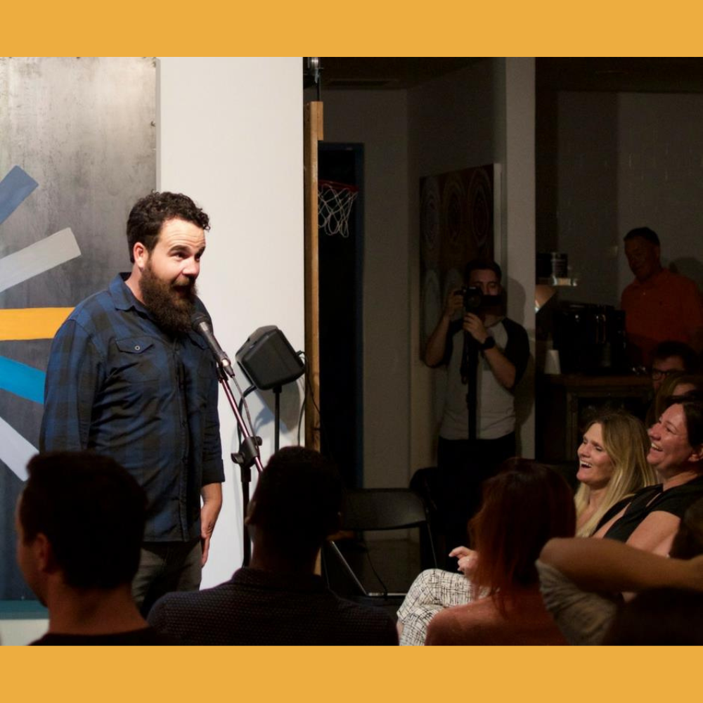 Comedy event featuring screenwriter Aaron Vaccaro and a laughing audience