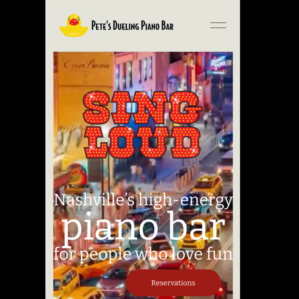 Website for Pete's Dueling Piano Bar in Nashville, featuring a background image of a city street at night with cars and pedestrians, and text advertising the venue as Nashville's high-energy piano bar for people who love fun.