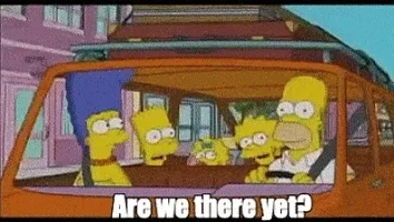 The Simpsons in a car with the kids asking "Are We There Yet?"