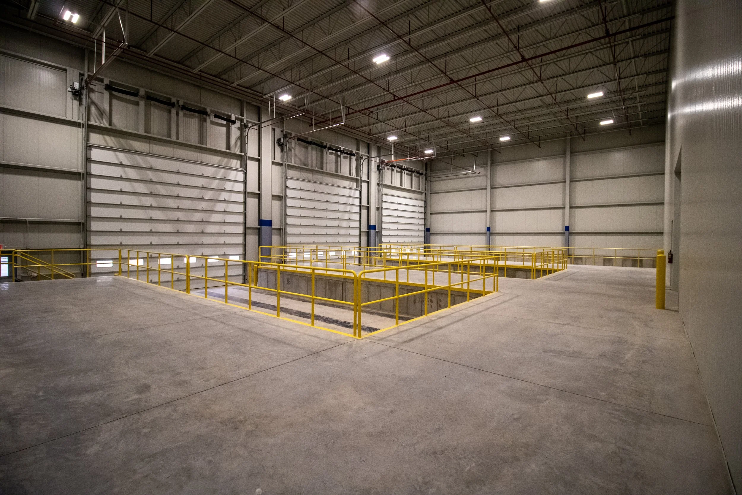 LED lighting installation with nLight controls in expanded industrial facility.
