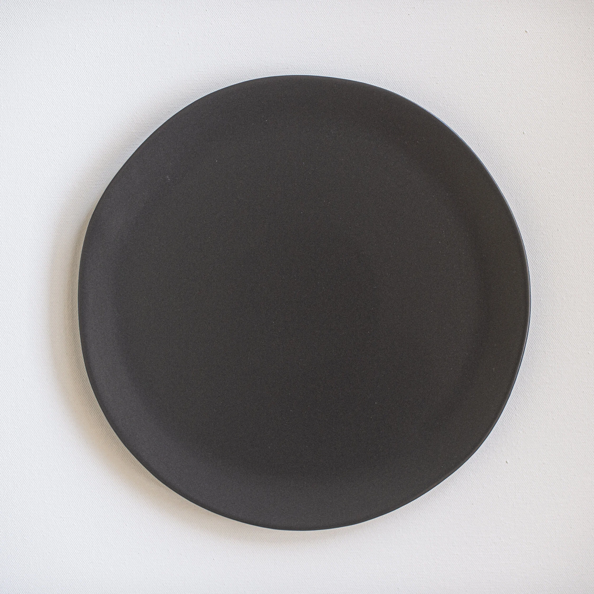 cocoa ceramic stoneware rental plate with organic shape