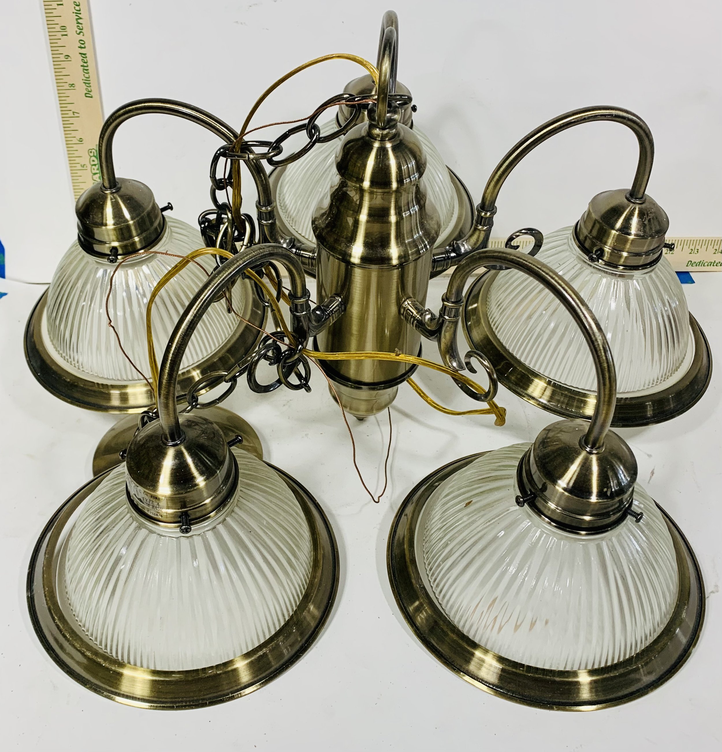 Chandelier with five glass lights with brass rings