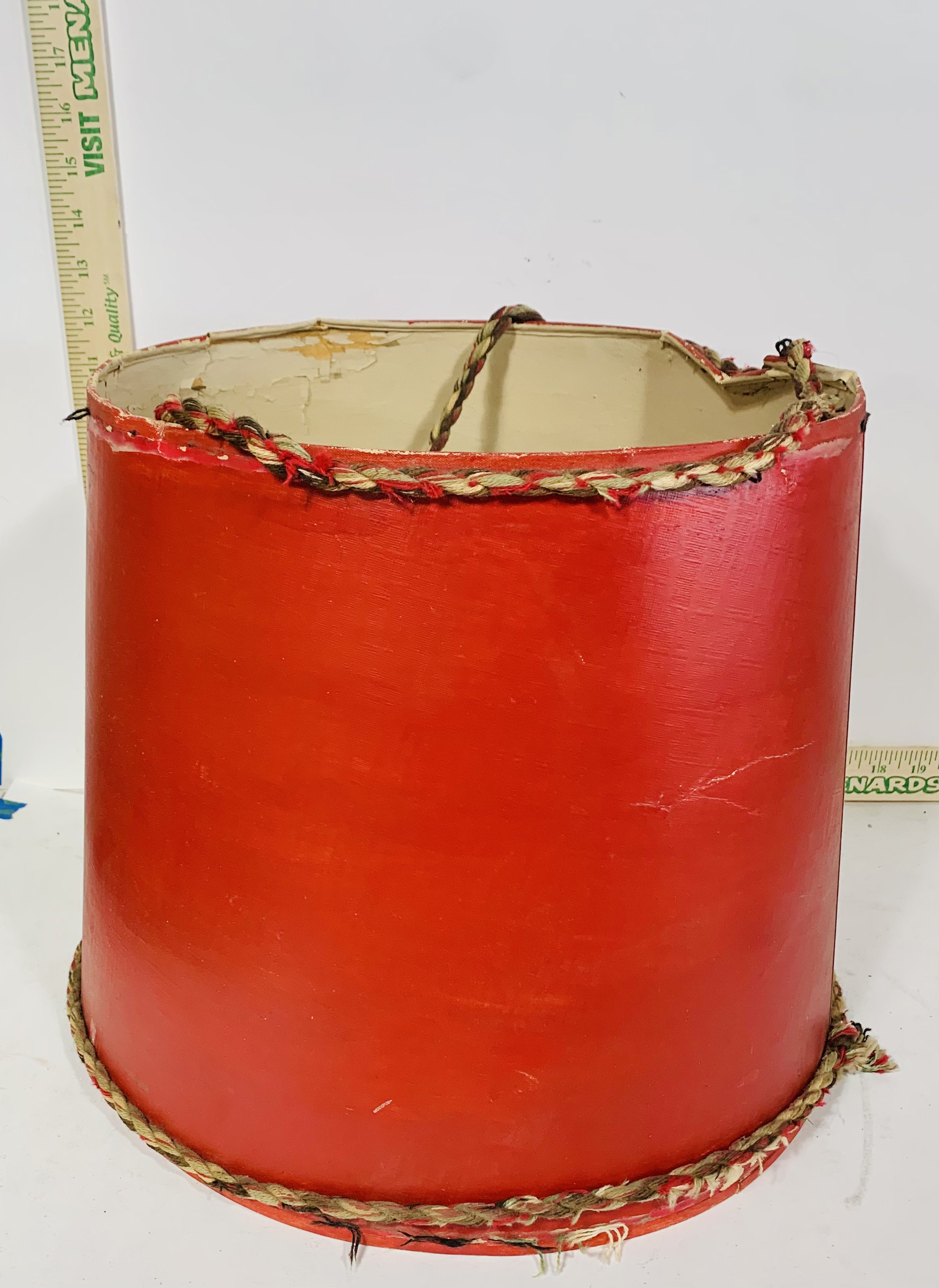 Red lampshade against white background