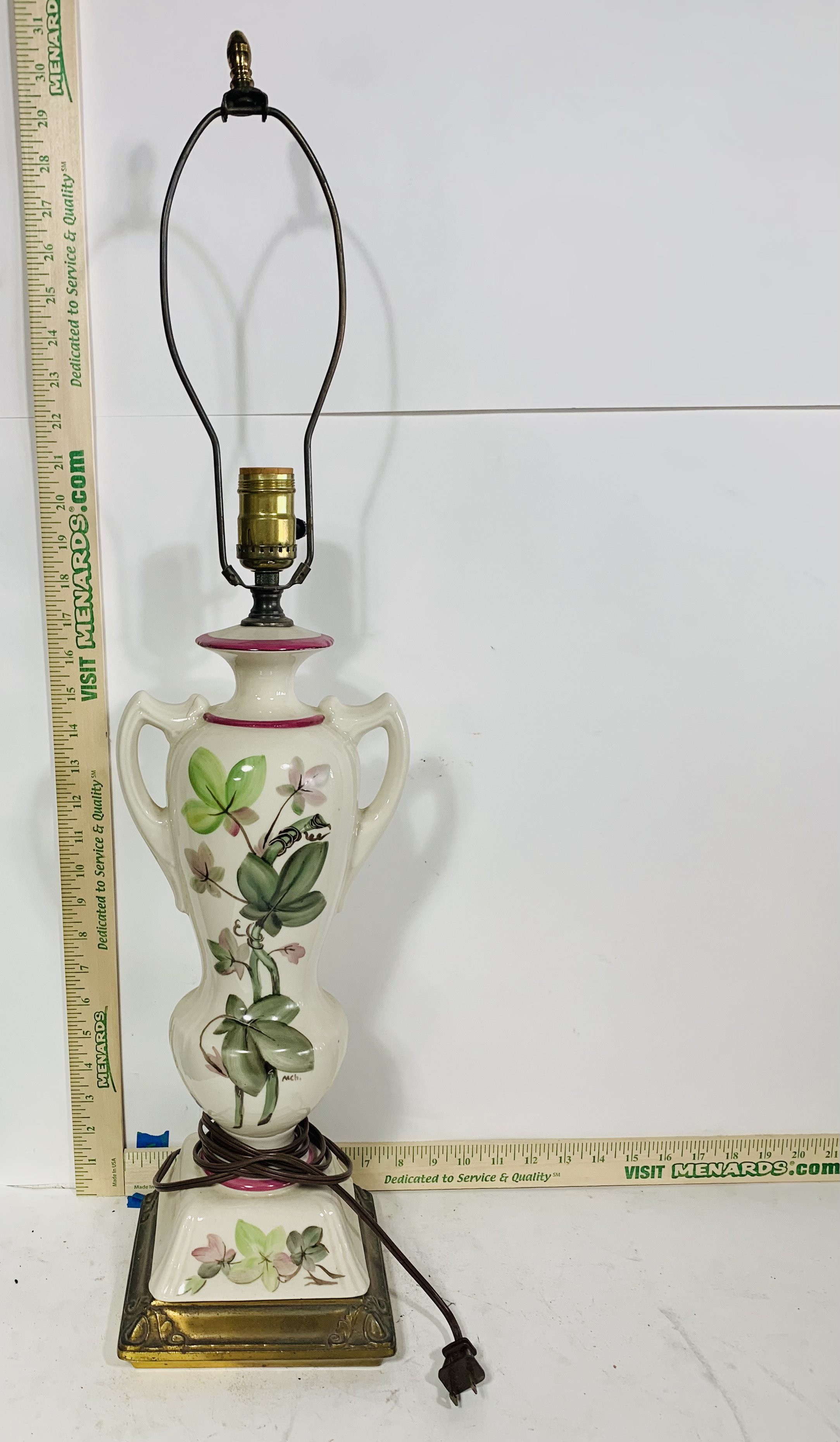White table lamp with botanical motif and no shade
