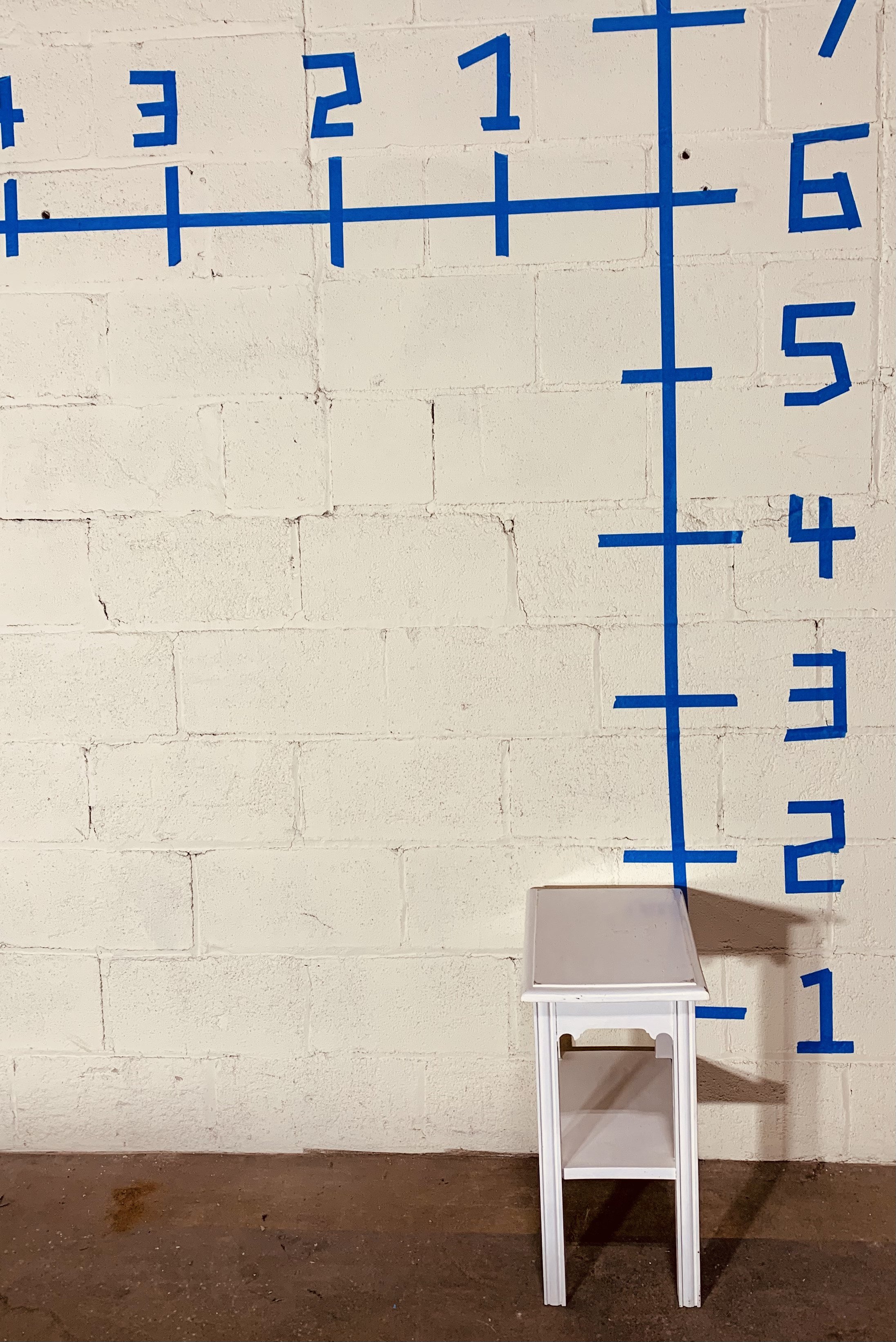 White side table, side view, dimensions shown