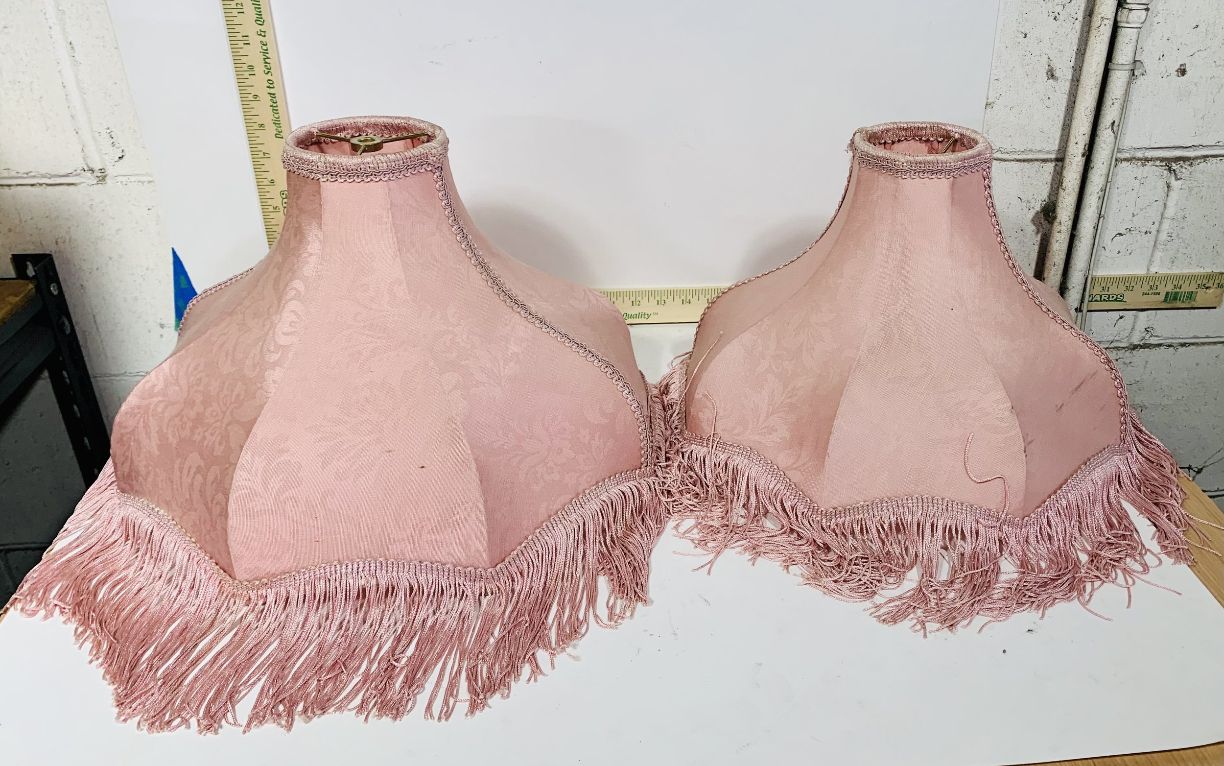 Pair of pink fringed lampshades
