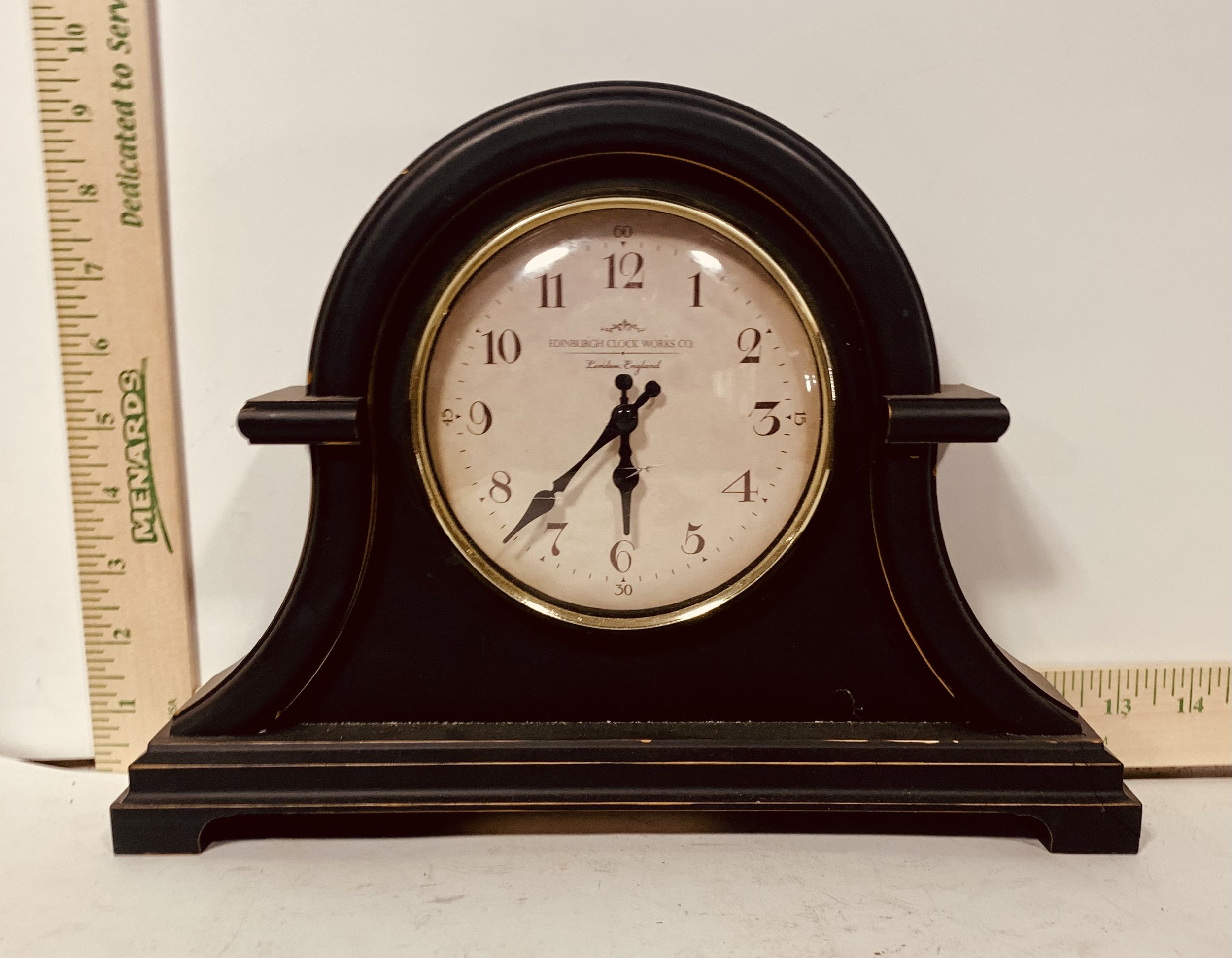 Dark wood mantel clock with rulers