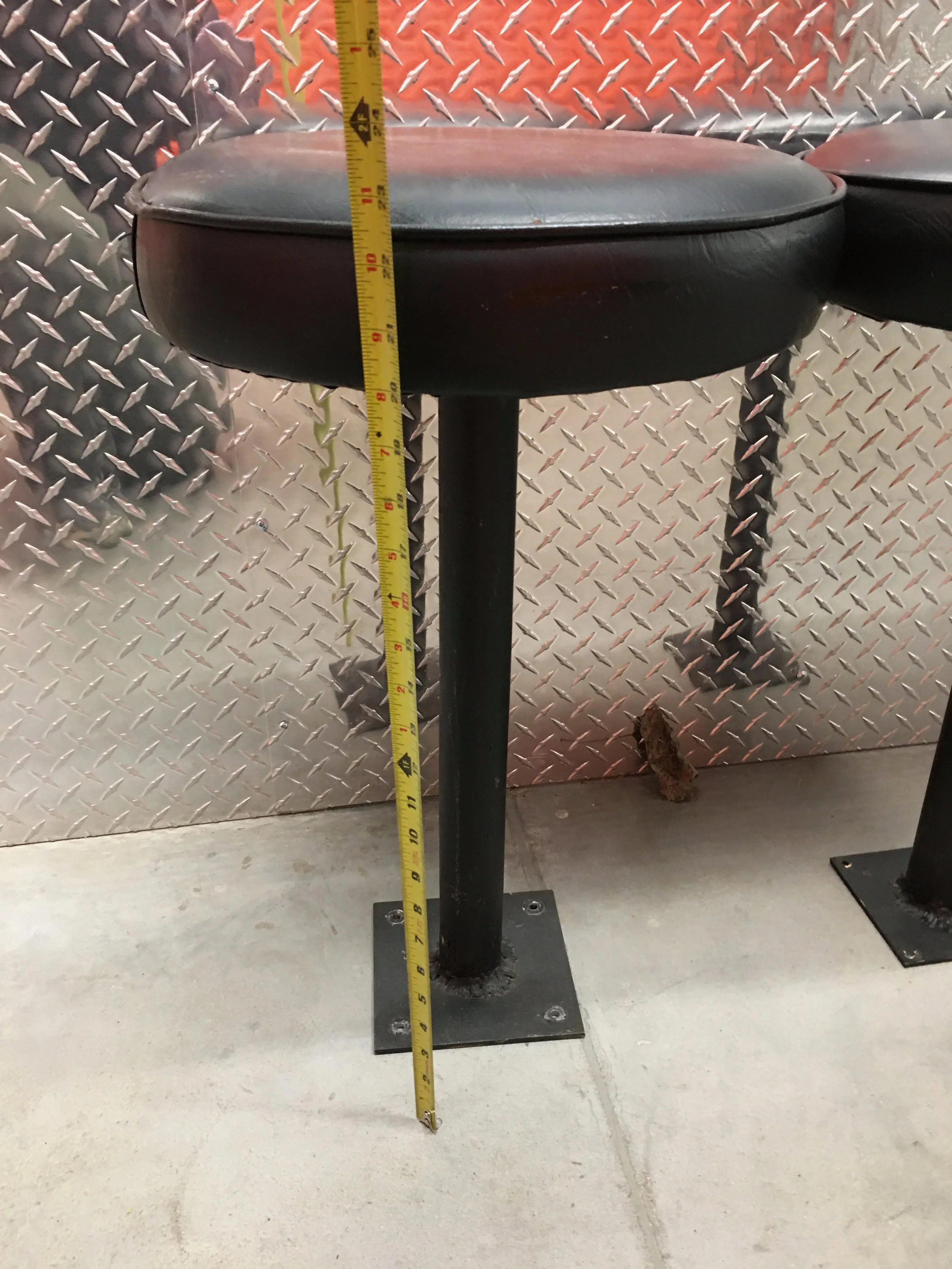 side view black bar stool with tape measure