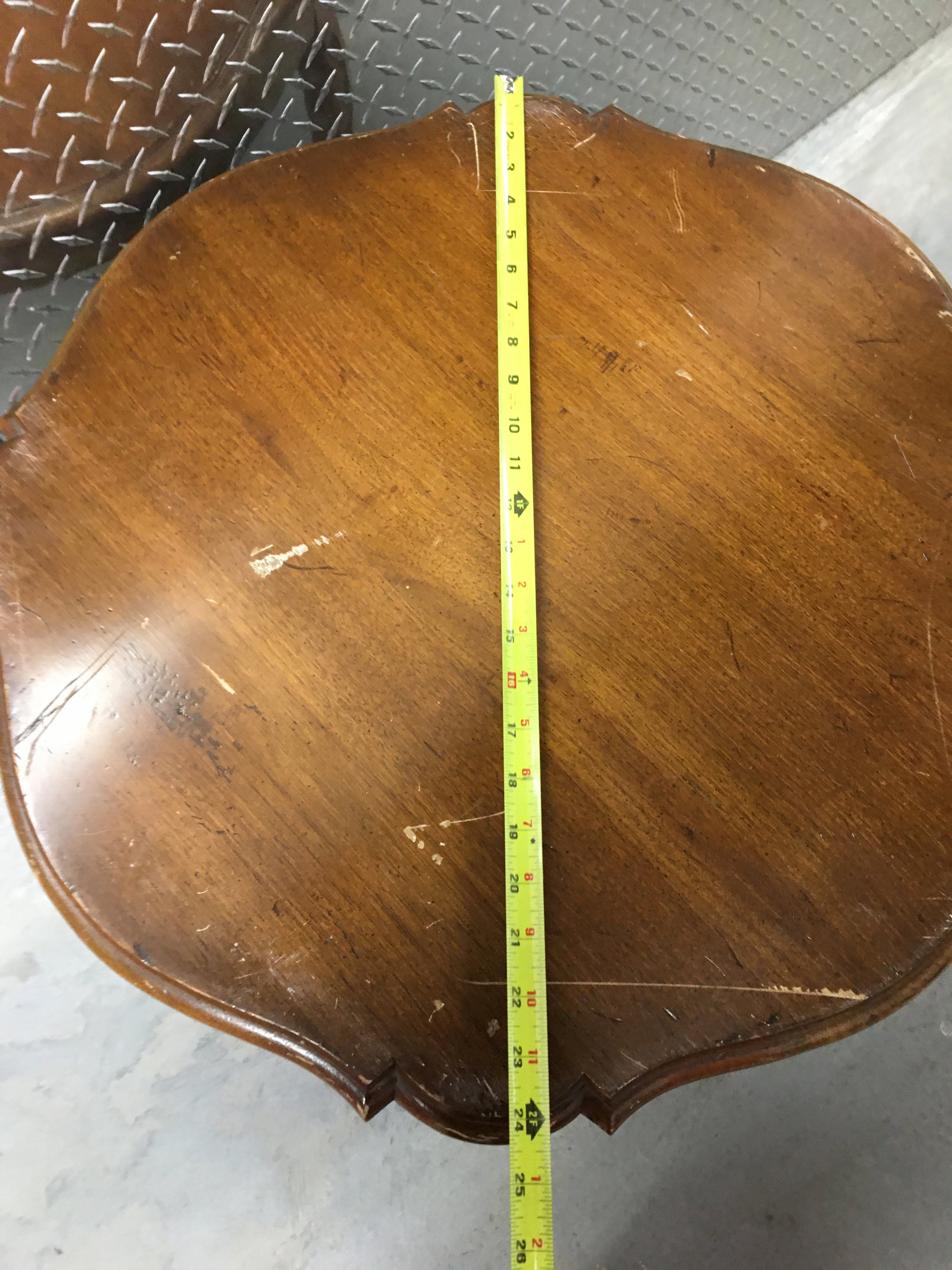 top of round wood side table with tape measure