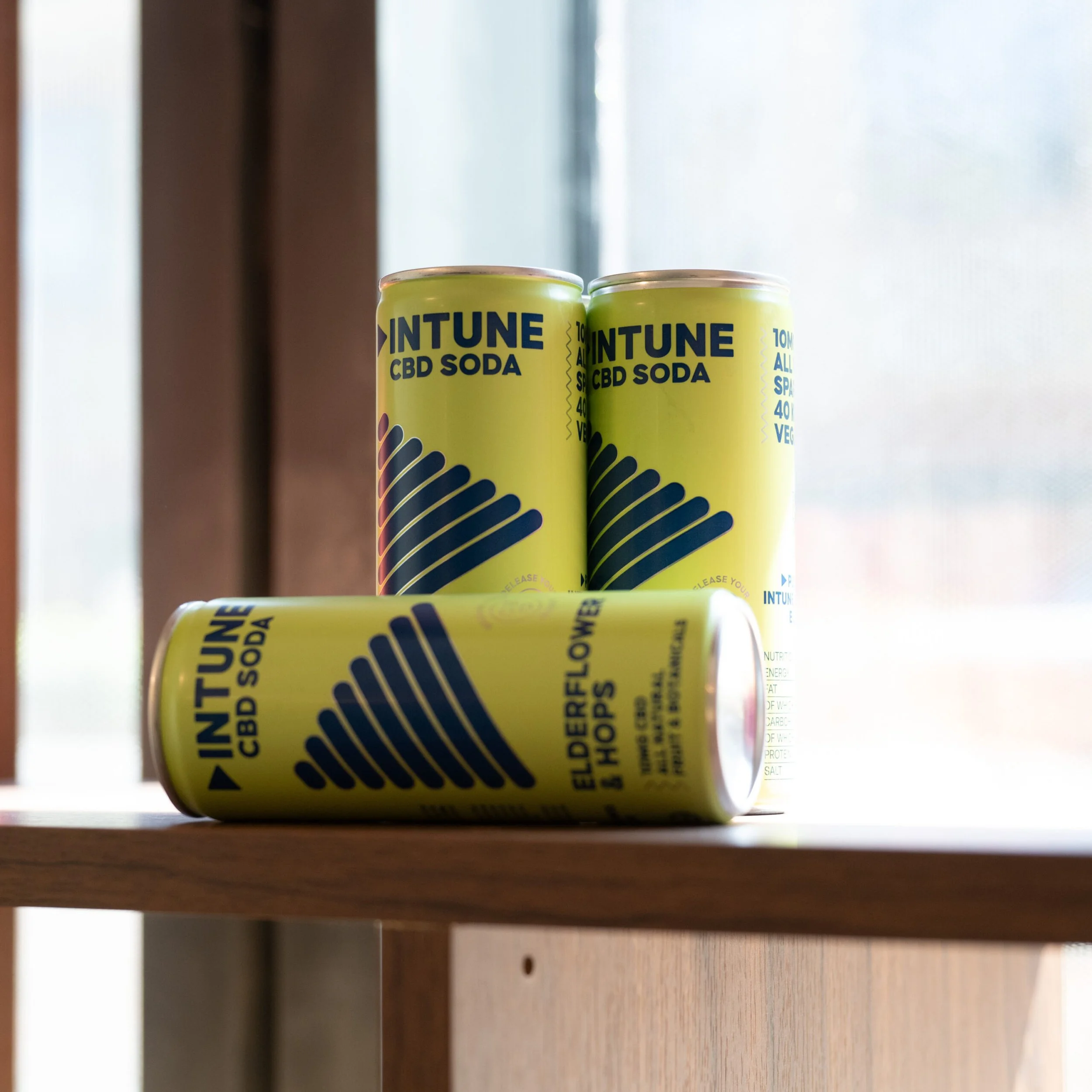 Two cans of Intune CBD sparkling drinks on display at Being Wellness Centre in St Albans as part of the centre's premium refreshments offering.