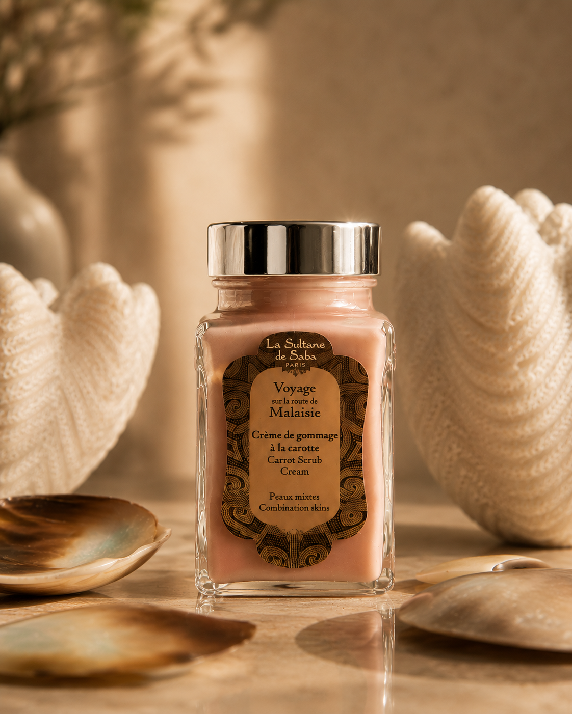 La Sultane de Saba Paris Carrot Scrub Cream displayed at Being Wellness Centre in St Albans, surrounded by natural seashells to showcase premium French skincare for body treatments and holistic wellbeing.