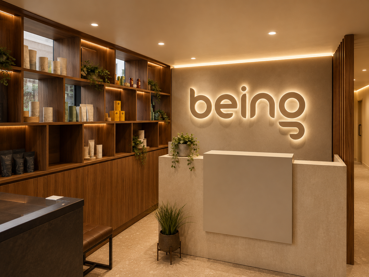 The welcoming reception at Being Wellness Centre in St Albans, featuring a modern reception desk, illuminated Being sign, natural wood shelving, wellness products and indoor plants in a peaceful contemporary setting.