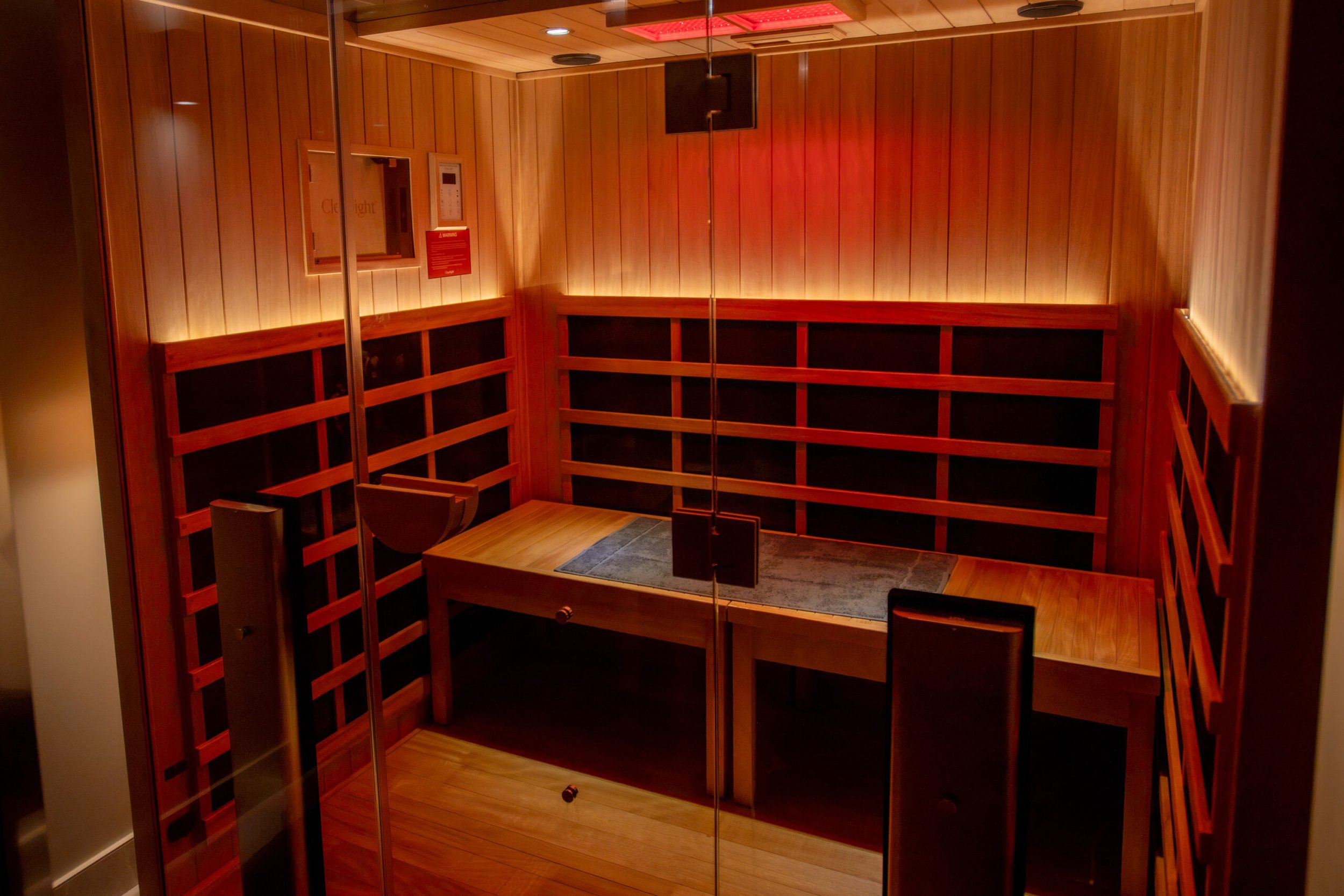 Private infrared sauna room at Being Wellness Centre in St Albans, featuring timber-lined walls and a modern wellness environment for relaxing infrared heat therapy.