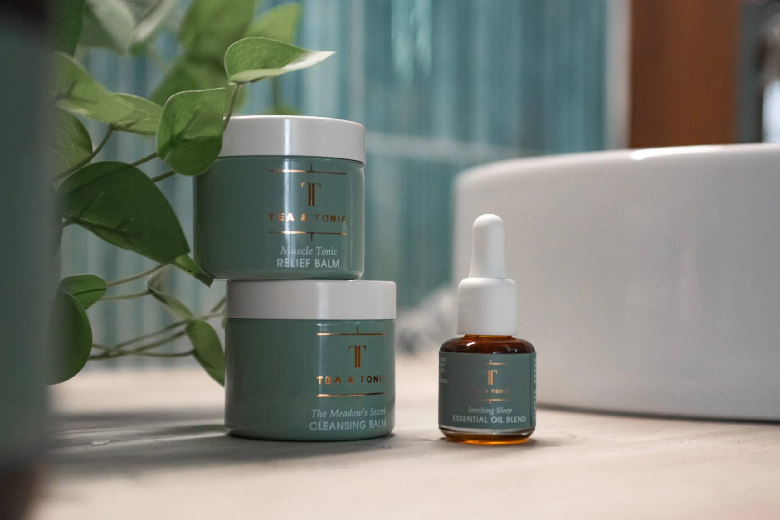 Tea & Tonic massage products and an essential oil blend displayed at Being Wellness Centre in St Albans, highlighting premium botanical products used during professional massage treatments.