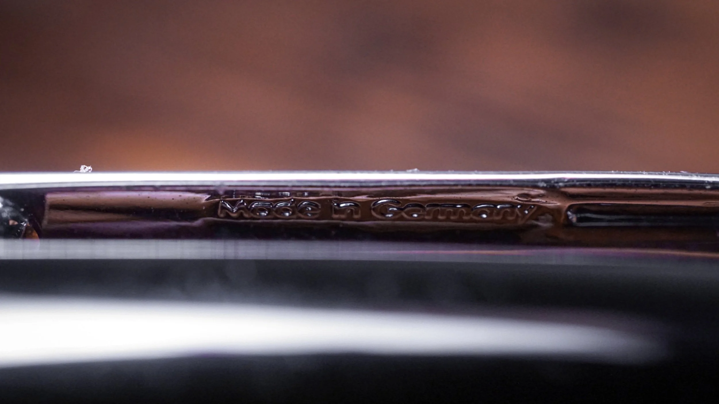 a clearly stamped clip with a messy phrase Made in Germany on the underside of the fake 144 clip