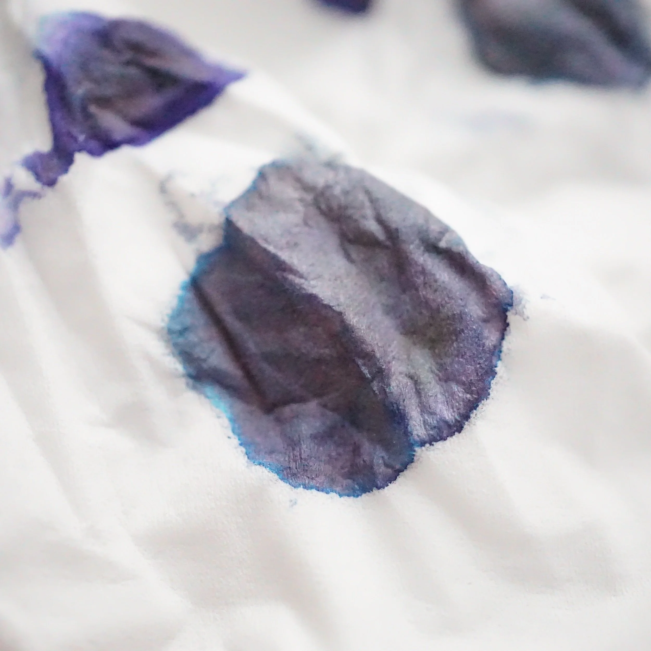 the green-ish-somewhat-teal color is coming through nicely on a piece of tissue paper