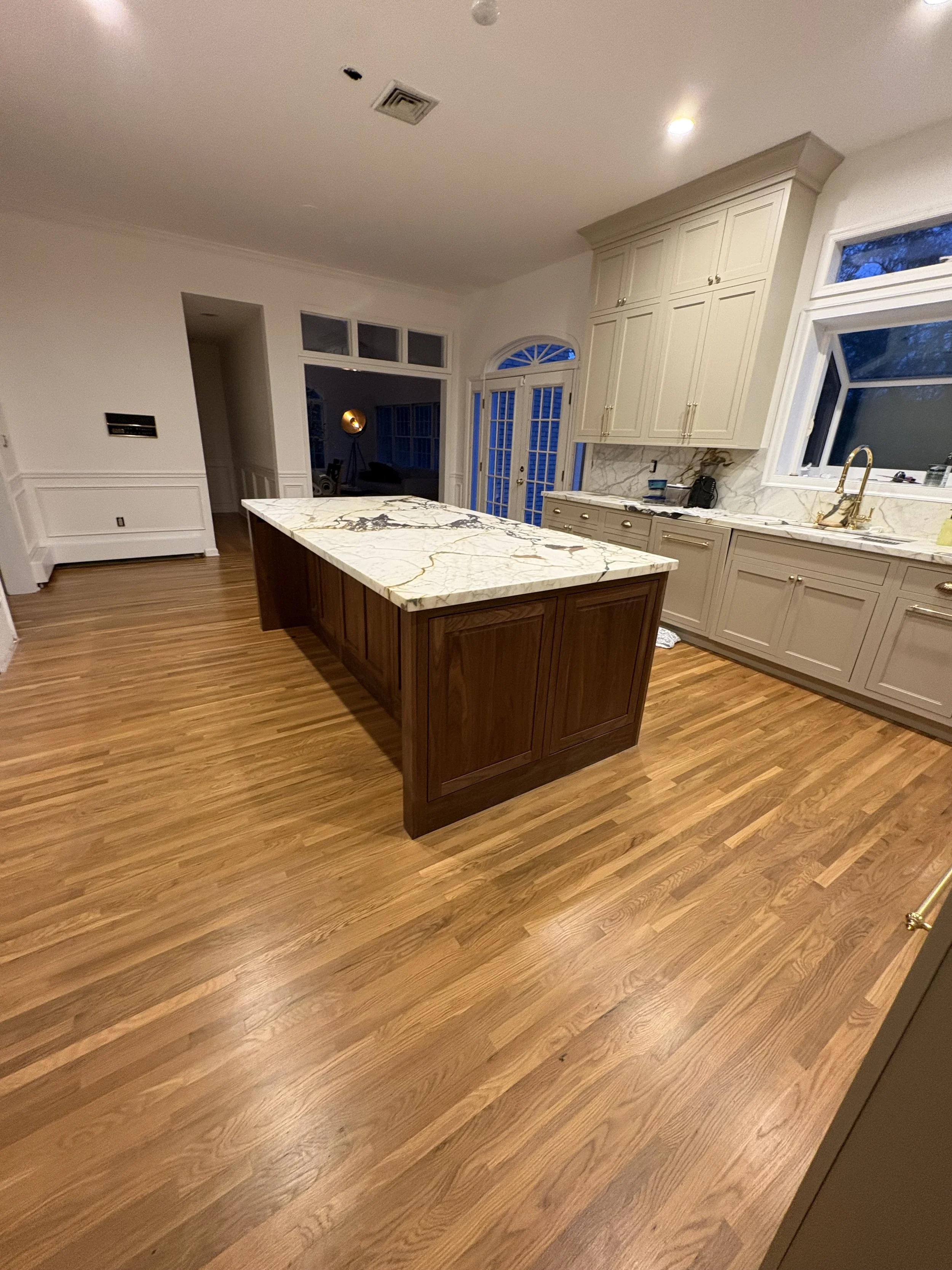 mahogany kitchen island with wide walkways creating a large open feeling