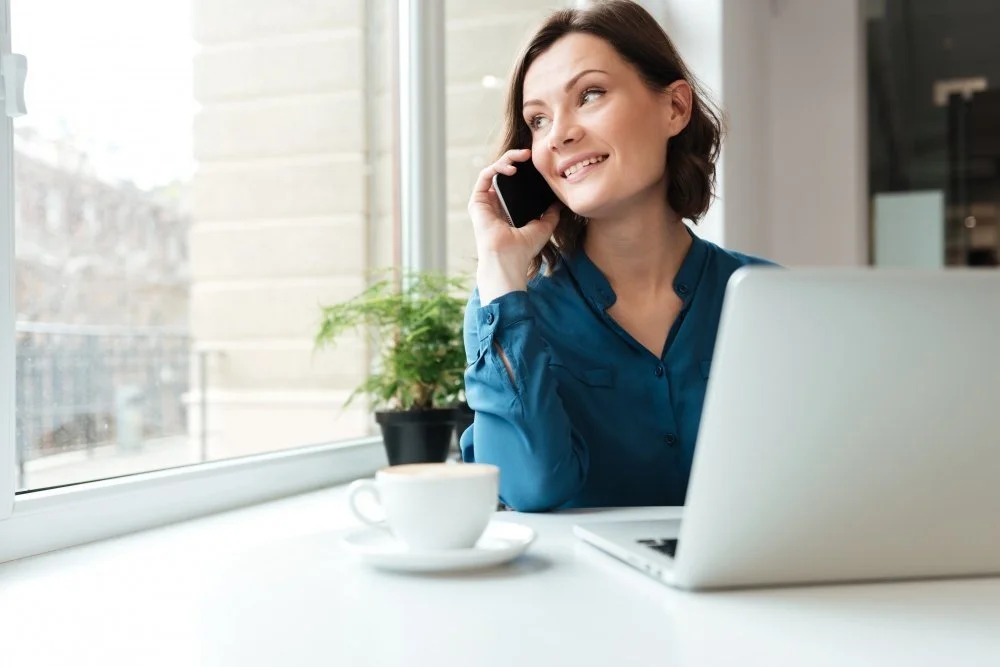 Woman business owner researching franchise opportunities on her laptop
