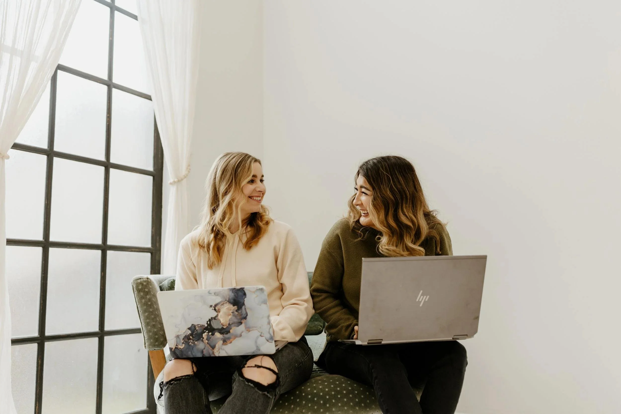 Women business owners collaborating as they grow their companies