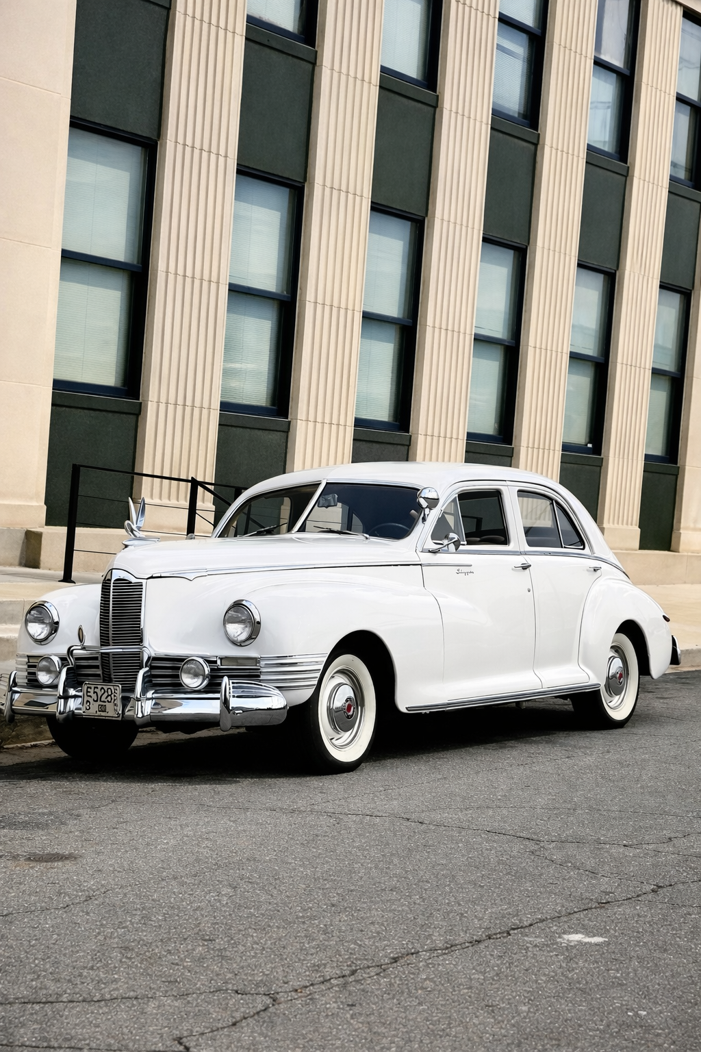 Vintage Packard by historic building.png