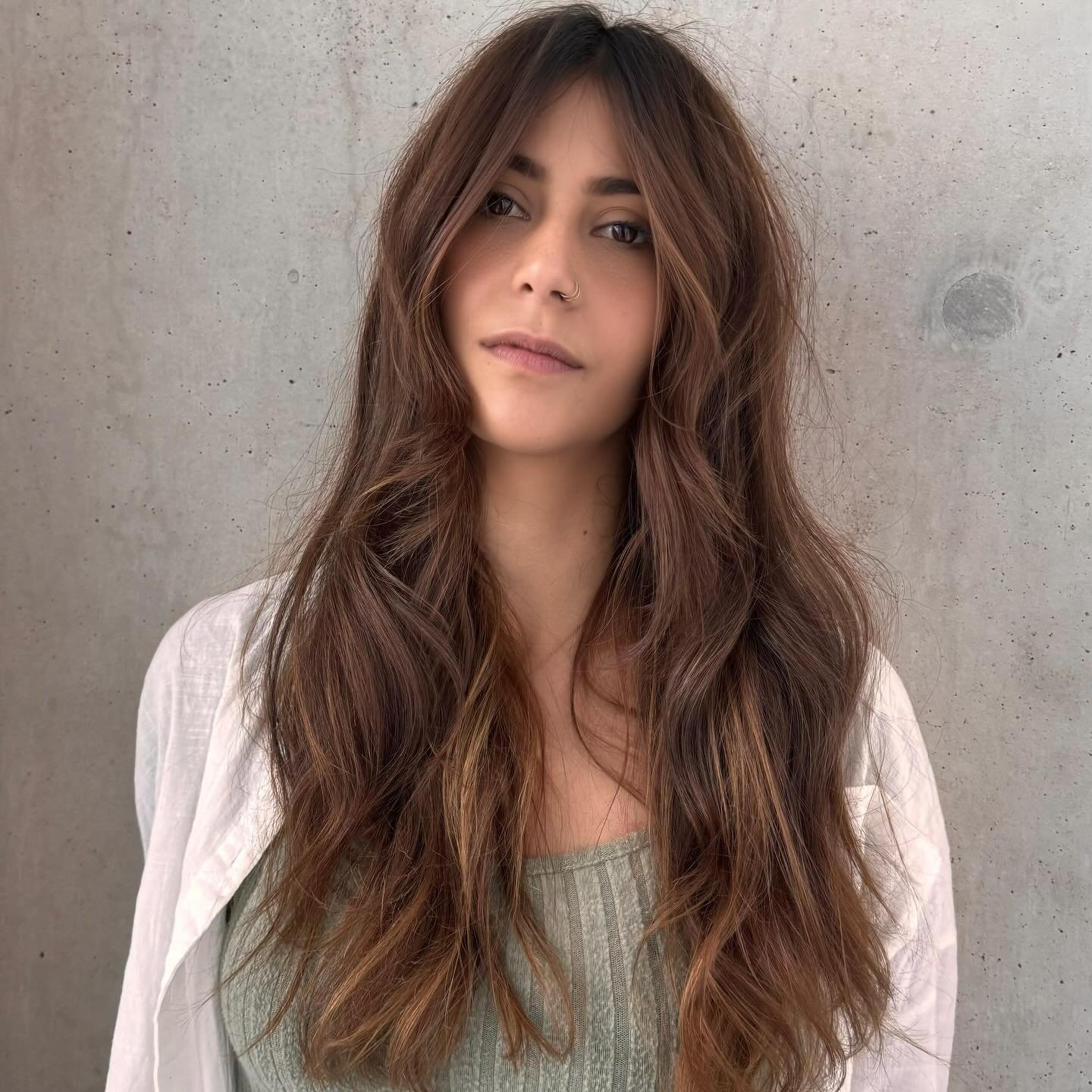 Sun-kissed Balayage. 

Ribbons of freehand Balayage to enhance a natural warm brunette are a match made in hair colour heaven. This kind of colour has subtle beauty, longevity and retains condition. 

The perfect enhancement for summer hair vibes. Ba