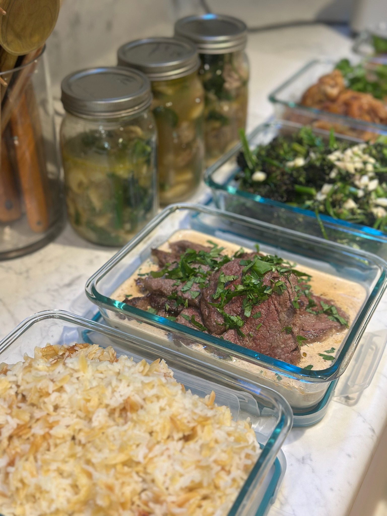 Seasonal personal chef meal with braised beef, rice, and vegetables prepared by Uproot Culinary.