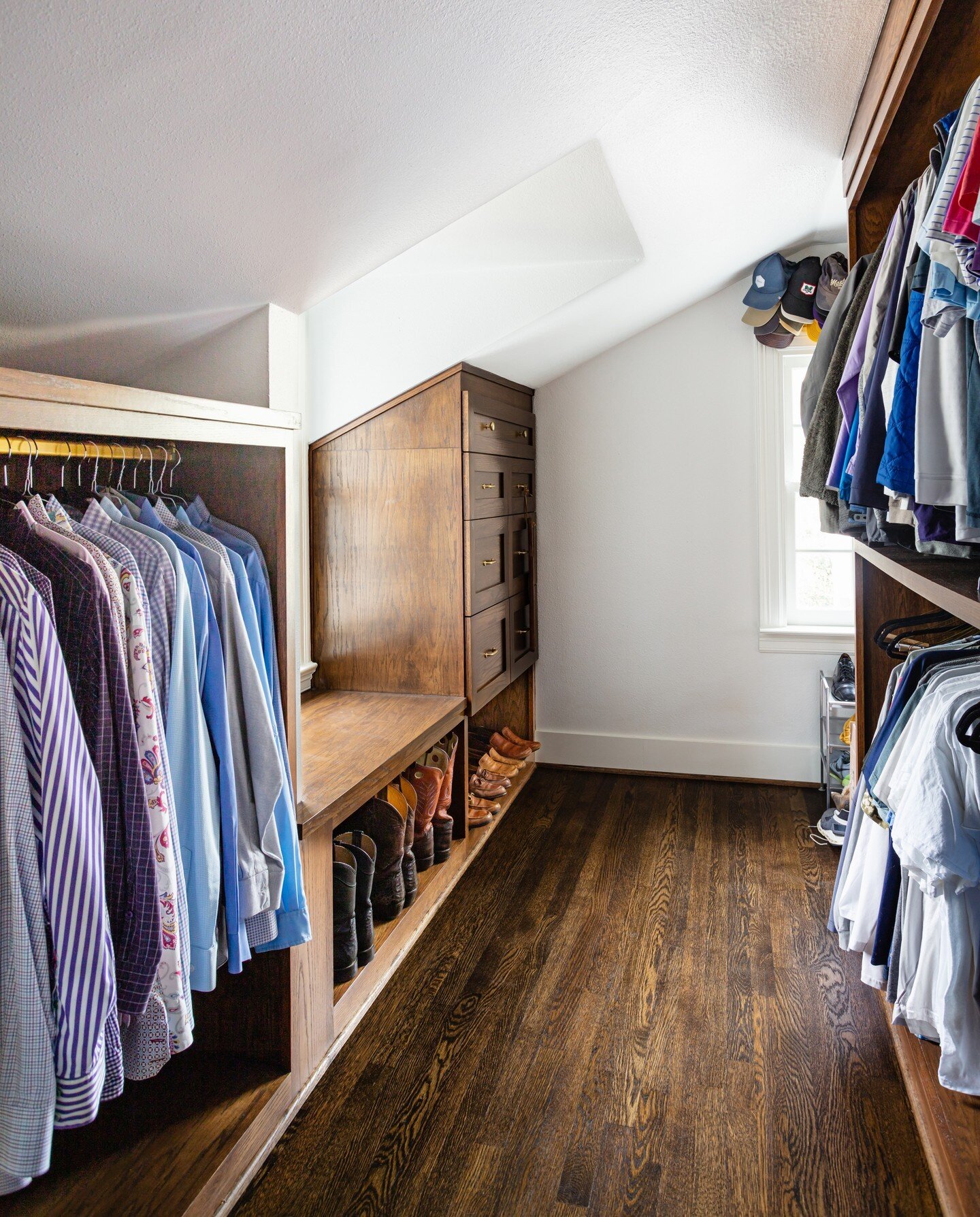 Who said we needed to save beautiful closets for the ladies alone?

Not us! So we built it.

As a part of their primary suite remodel, the Drapers wanted closets that wowed, and we knew just what to do: dark walnut floors that make a statement agains