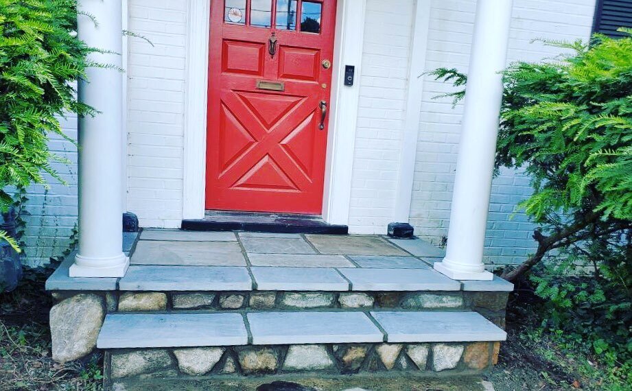 Home sweet home 🏠❤️This front stoop with thermo blue flagstone and Maryland blend thinstone provides an elegant entry and warm welcome. Call us for a free estimate on your next exterior project. #stone #flagstone #masonry #frontstoop #frontsteps #ho