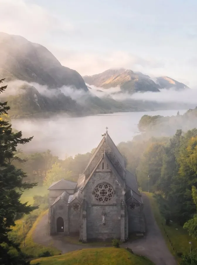 Catholic Church of St Mary and St Finnan overlooking Loch Shiel in Glenfinnan, Scotland. Photographer Unknown