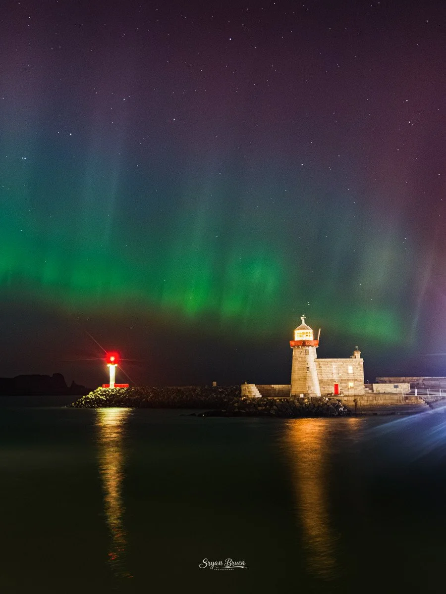 The aurora dancing over Howth Lighthouses by  Sryan Bruen 
