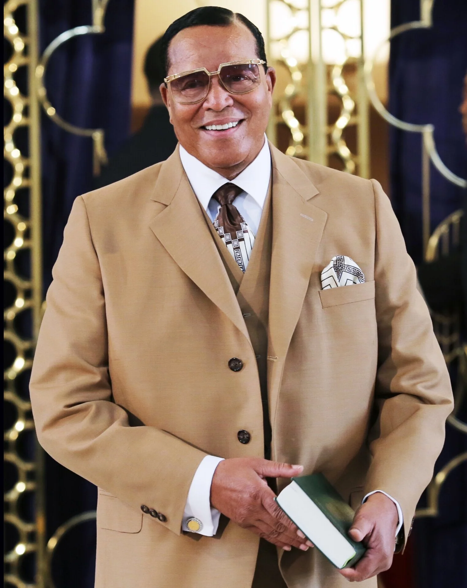 HMLF gold suit with quran.jpg
